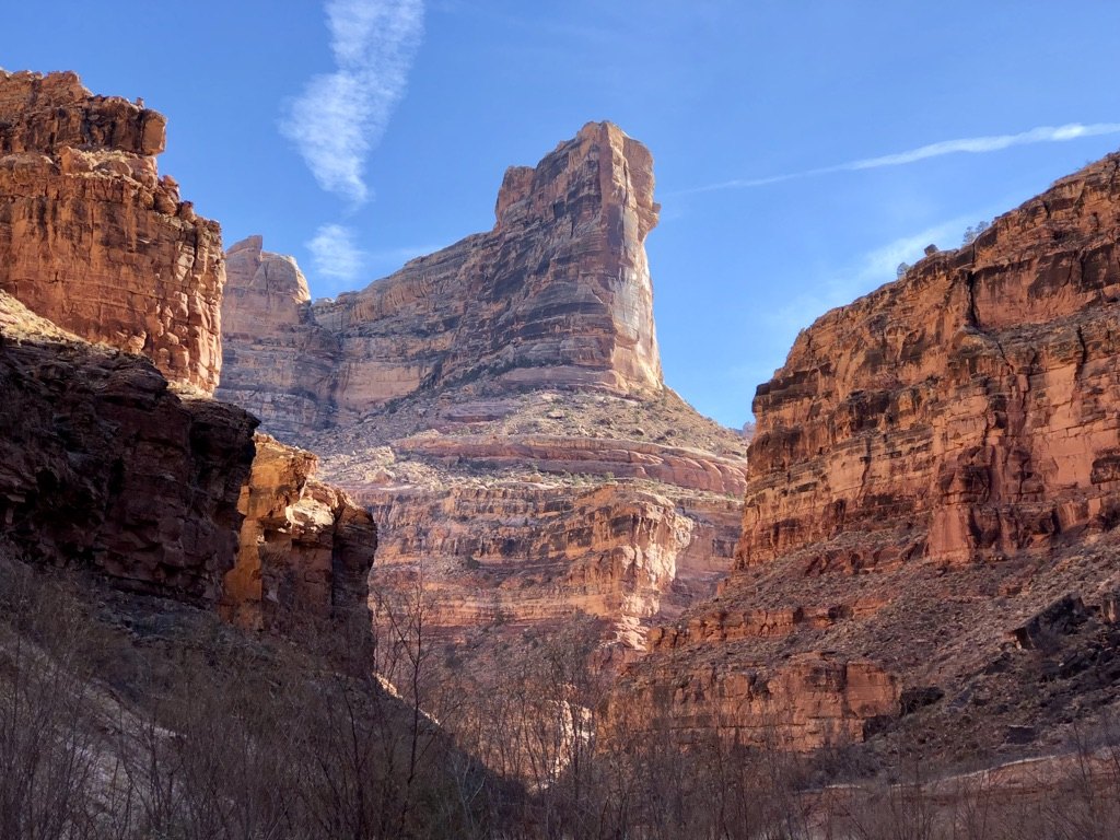 Warm red rock canyon walls under blue sky